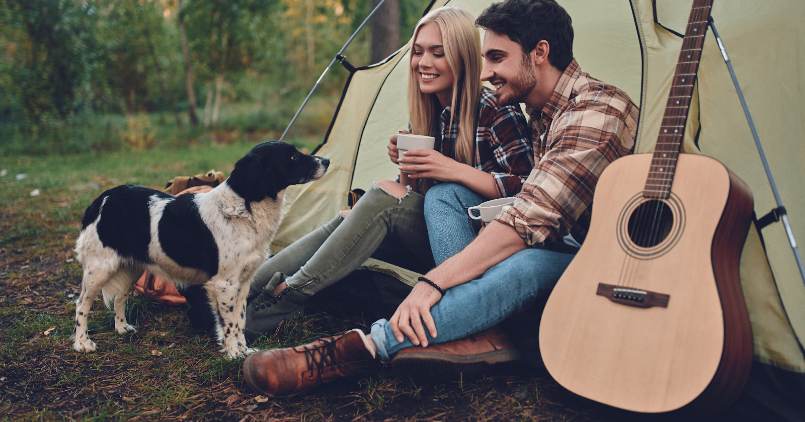 dog with couple in tent with guitar